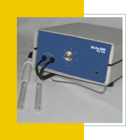 Blue and white electronic device with cables and glass tubes.