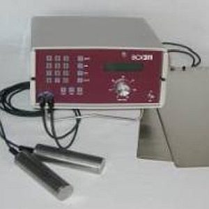 Medical device with cables and sensors on a table.