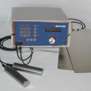 A vintage medical or scientific device with control panel and attached probes.