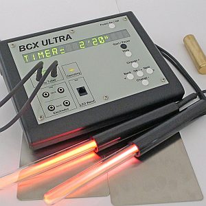Close-up of a BCX Ultra Extera device with glowing red light probes.